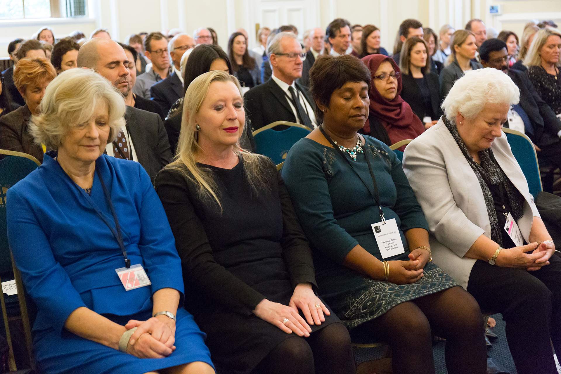 5 Mindful Lessons from the Halls of Westminster - Image of Parliamentarians practicing at a Mindfulness All-Party Parliamentary Group hearing on mindfulness