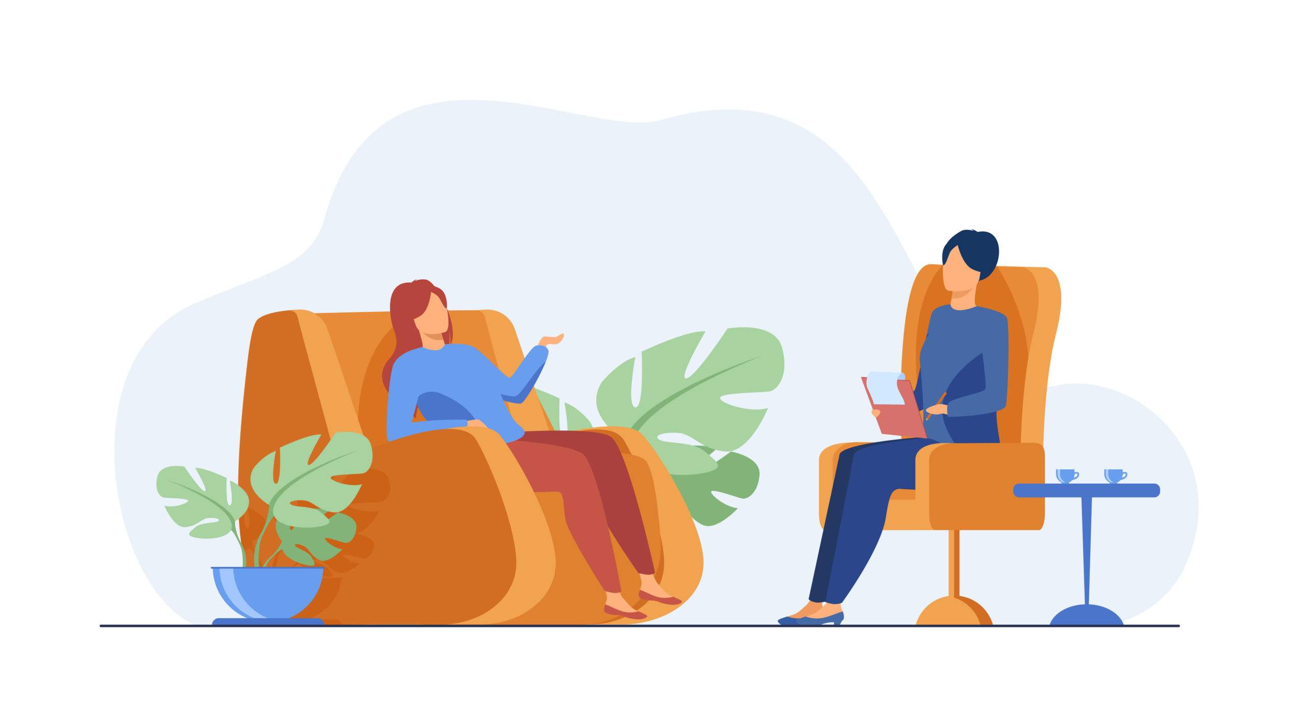 Two people sitting in orange armchairs having a conversation.