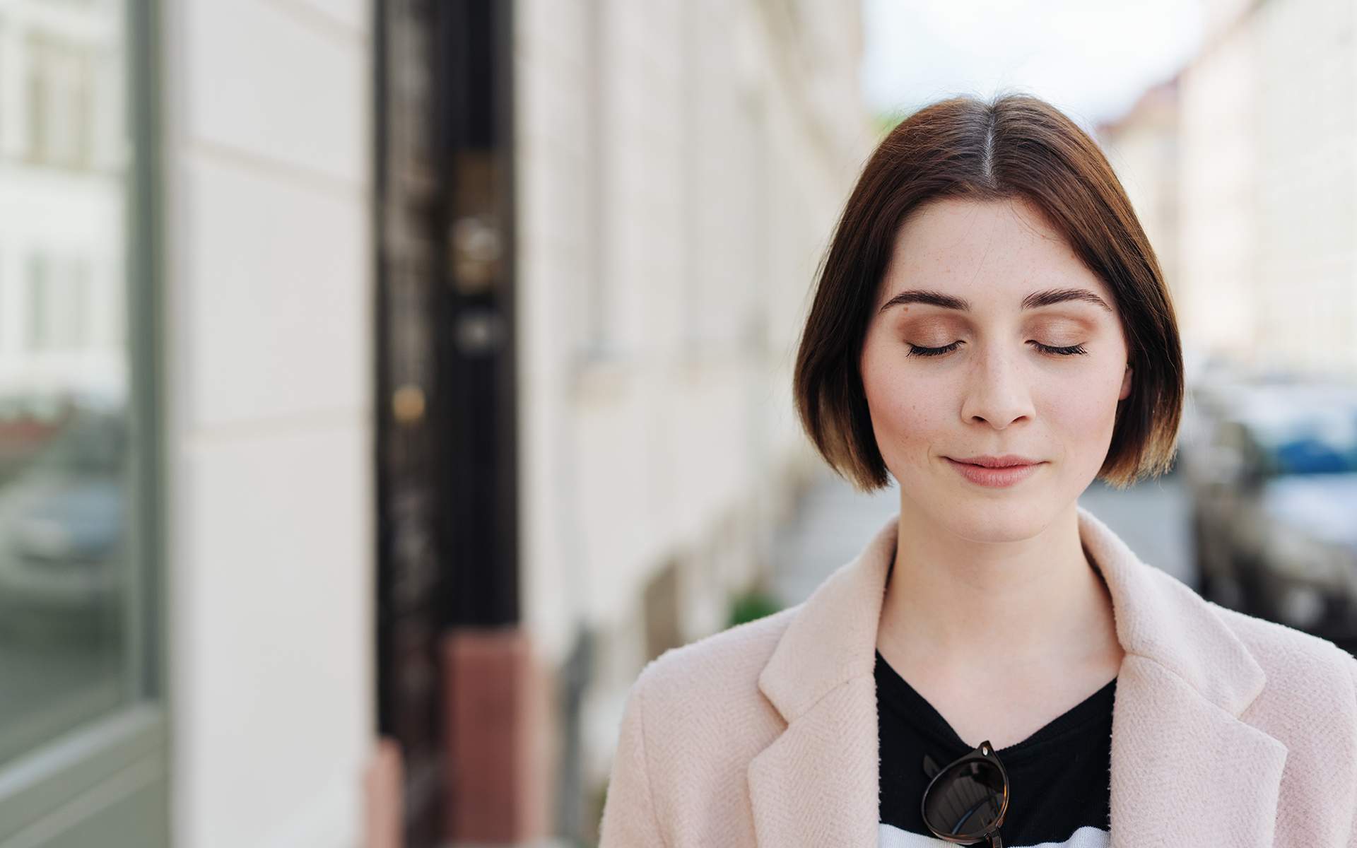 A 15-minute equanimity meditation to cultivate equanimity -Young woman standing with closed eyes