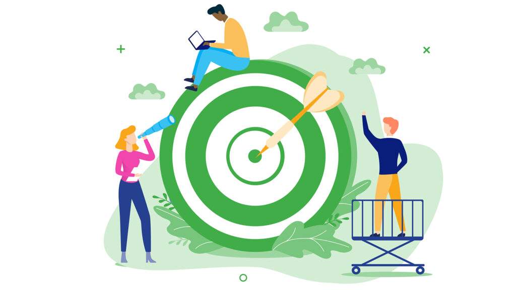 People working together around a large target symbol, representing teamwork and goal achievement.
