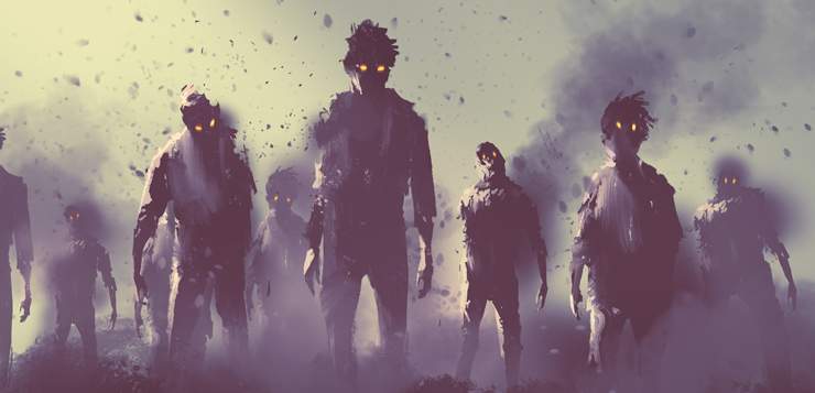 A group of zombies walking through fog.