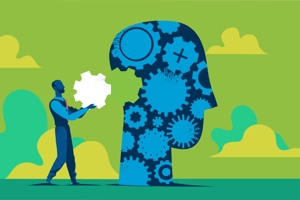 A person inserting a gear into a large blue head made of gears, representing innovation and creative thinking.