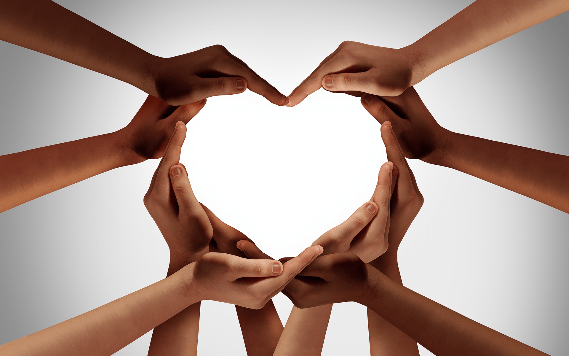 10 hands form a heart shape, a symbol of mindful leaders healing trauma