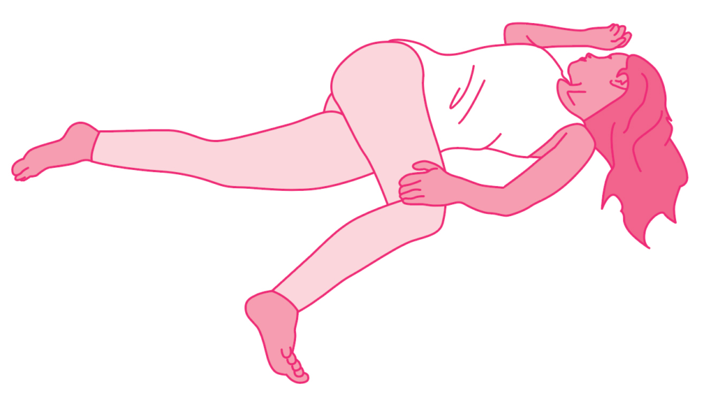 A person in pink clothing lying on their back with one leg raised.